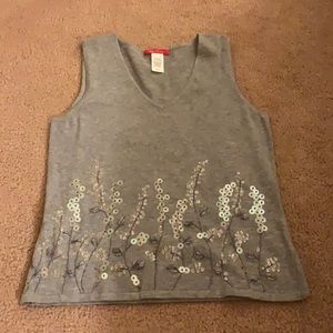 Never worn Anne Klein v-neck vest, floral design along bottom, gray, size small.